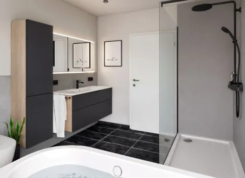 Das Bild zeigt ein Designerbad mit hängendem Waschtisch in Holz-Anthrazit-Kombination und indirekter Spiegelbeleuchtung. Die angrenzende Walk-in-Dusche ist mit einer rahmenlosen Glasabtrennung und schwarzer Regendusche ausgestattet.