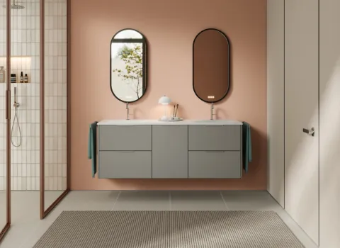 Waschtisch aus der Kollektion Oteo des Herstellers burgbad in der Farbe Kieselgrau softmatt mit zwei ovalen Spiegeln.